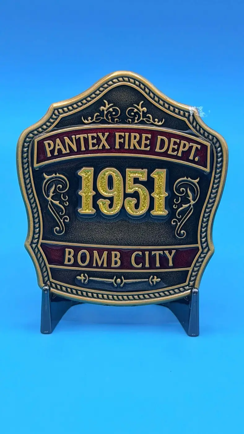 Custom badge-shaped gold challenge coin with scrollwork borders